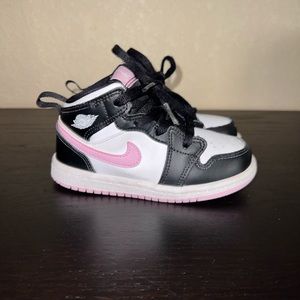 Black pink and white Nikes